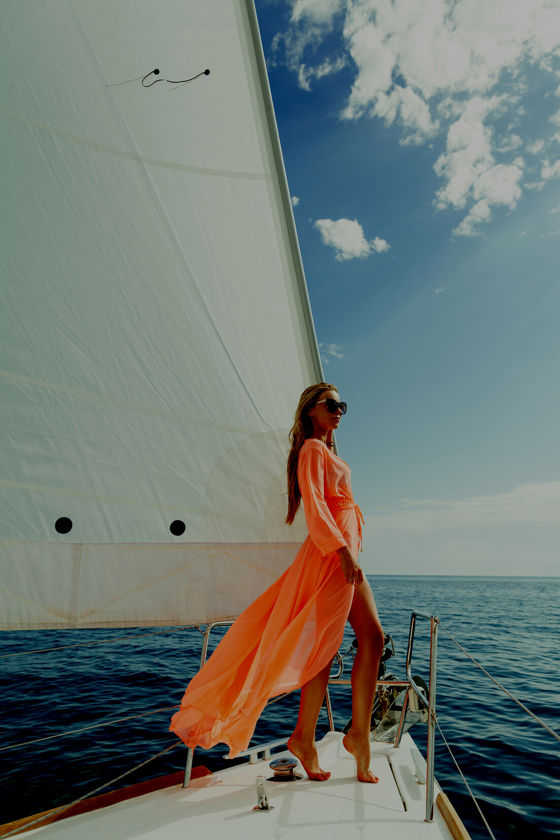 Woman in Sarong Yachting White Sails Luxury Travel